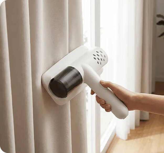 Aspirador em cortinas e estofos